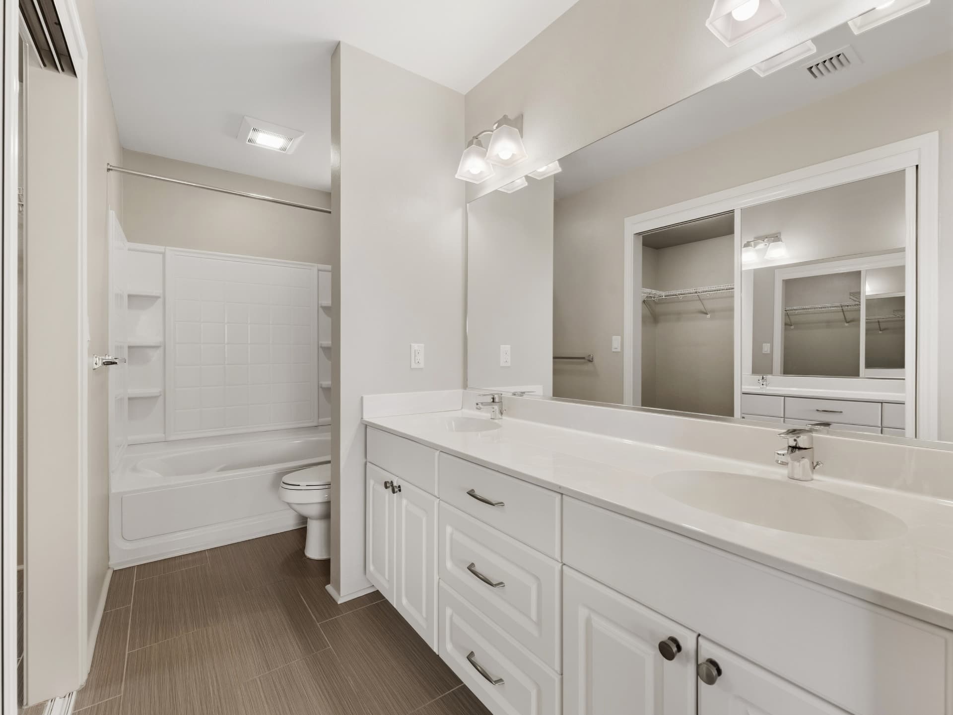 Full bathroom with soaking tub and double vanity